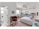 Bright bedroom with a ceiling fan, desk, and plenty of natural light from the large window at 4616 Blue Marlin Dr, Bradenton, FL 34208