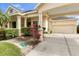Lovely single-Gathering home showcasing covered parking, lush landscaping, and a well-manicured lawn at 4616 Blue Marlin Dr, Bradenton, FL 34208