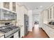 Galley kitchen boasts stainless appliances, granite countertops, and ample cabinet space at 4616 Blue Marlin Dr, Bradenton, FL 34208