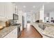 Galley kitchen boasts stainless appliances, granite countertops, and ample cabinet space at 4616 Blue Marlin Dr, Bradenton, FL 34208