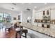 Open kitchen with granite counters, stainless steel appliances, and a breakfast bar with seating at 4616 Blue Marlin Dr, Bradenton, FL 34208