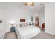 Bright main bedroom features neutral decor, ceiling fan, and access to the ensuite bathroom at 4616 Blue Marlin Dr, Bradenton, FL 34208