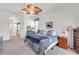 Bright main bedroom featuring a large window, stylish décor and closet at 4616 Blue Marlin Dr, Bradenton, FL 34208