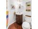 Cozy powder room features a corner sink with a decorative mirror and modern fixtures at 4616 Blue Marlin Dr, Bradenton, FL 34208