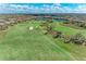 Expansive aerial shot of a meticulously maintained golf course with sand traps at 4632 Benito Ct, Lakewood Ranch, FL 34211