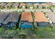 Beautiful aerial shot of backyard pools with screened enclosures and manicured lawns at 4632 Benito Ct, Lakewood Ranch, FL 34211