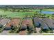 Picturesque aerial view of homes with tile roofs, brick driveways, and lush landscaping at 4632 Benito Ct, Lakewood Ranch, FL 34211