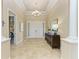 Bright foyer features tile flooring, neutral paint, and direct access to a bedroom and living spaces at 4632 Benito Ct, Lakewood Ranch, FL 34211