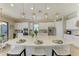 Bright kitchen with a large island, stainless steel appliances, pendant lighting, and bar stool seating at 4632 Benito Ct, Lakewood Ranch, FL 34211