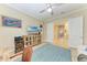 Comfortable living room with a television, a window, and a ceiling fan at 4632 Benito Ct, Lakewood Ranch, FL 34211