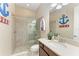 This bathroom has a glass enclosed shower, stylish mirror, and decorative accents at 4632 Benito Ct, Lakewood Ranch, FL 34211
