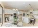 Bright kitchen with white cabinets, stainless steel appliances, island with seating, and modern lighting at 4632 Benito Ct, Lakewood Ranch, FL 34211