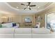 Spacious living room area featuring tile floors, recessed lighting, comfortable seating, and access to the screened-in lanai at 4632 Benito Ct, Lakewood Ranch, FL 34211