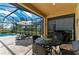 Outdoor patio features ample seating, lounge chairs, and a view of the pool and landscaping at 4632 Benito Ct, Lakewood Ranch, FL 34211
