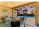 Outdoor patio space features a comfortable seating area overlooking the sparkling pool and landscape at 4632 Benito Ct, Lakewood Ranch, FL 34211