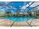 This screened-in pool offers a tranquil space with lush landscaping and clear blue water at 4632 Benito Ct, Lakewood Ranch, FL 34211