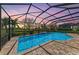 Stunning screened-in pool area boasts a serene atmosphere and beautiful landscaping at 4632 Benito Ct, Lakewood Ranch, FL 34211