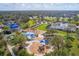 Aerial view of community park with playground, splash pad, and covered picnic areas surrounded by lush green landscaping at 4724 Tilden Park Ct, Bradenton, FL 34211
