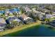 Overhead shot of a community home with a screened-in pool area near a lake, showcasing community living at 4724 Tilden Park Ct, Bradenton, FL 34211