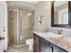 Modern bathroom featuring a glass-enclosed shower, stylish vanity, and granite countertops for a luxurious feel at 4724 Tilden Park Ct, Bradenton, FL 34211
