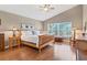 Relaxing bedroom with vaulted ceilings, natural light, and classic wood furnishings for a serene retreat at 4724 Tilden Park Ct, Bradenton, FL 34211