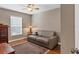 Neutral guest bedroom with a comfortable sofa and good light at 4724 Tilden Park Ct, Bradenton, FL 34211