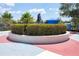 Community gathering spot featuring a statue surrounded by a colorful splash pad and landscaping at 4724 Tilden Park Ct, Bradenton, FL 34211