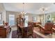Elegant dining room featuring a large table, ample seating, and a view into the adjacent living area at 4724 Tilden Park Ct, Bradenton, FL 34211