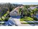 Inviting single-Gathering home boasts mature palm trees, a neatly maintained lawn, and a spacious three-car garage at 4724 Tilden Park Ct, Bradenton, FL 34211