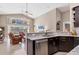 Bright, open kitchen featuring granite countertops, stainless steel appliances, and seamless flow to the living area at 4724 Tilden Park Ct, Bradenton, FL 34211