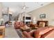 Inviting living room with bar seating, warm lighting, and comfortable leather seating, perfect for gatherings at 4724 Tilden Park Ct, Bradenton, FL 34211