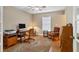 Home office with vintage furniture, wood floors and lots of space at 4724 Tilden Park Ct, Bradenton, FL 34211