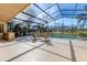 Outdoor dining area with poolside views at 4724 Tilden Park Ct, Bradenton, FL 34211