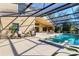 Resort style backyard pool and hot tub area with plenty of seating at 4724 Tilden Park Ct, Bradenton, FL 34211