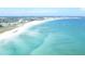 Breathtaking aerial view of a pristine white sand beach and turquoise ocean waters at 4839 Turtle Bay Ter, Bradenton, FL 34203