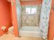 Bathroom with tub-shower combo, toilet, vanity and blue accents at 4839 Turtle Bay Ter, Bradenton, FL 34203