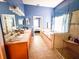 A spacious bathroom features a glass enclosed shower, soaking tub, and double vanities at 4839 Turtle Bay Ter, Bradenton, FL 34203