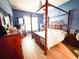 A Primary bedroom with a canopy bed frame, dresser, and ceiling fan at 4839 Turtle Bay Ter, Bradenton, FL 34203