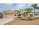 Charming single-story home featuring lush landscaping, a two-car garage and a well-maintained lawn at 4839 Turtle Bay Ter, Bradenton, FL 34203