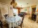 Inviting living room with tile floors, comfortable seating and a ceiling fan overlooking the backyard and pool at 4839 Turtle Bay Ter, Bradenton, FL 34203