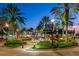 Charming town center with a fountain, palm trees, and inviting street lighting at 4839 Turtle Bay Ter, Bradenton, FL 34203