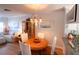 Cozy dining area with hardwood floors, a round table, and a charming chandelier at 5072 Misty Canal Pl, Bradenton, FL 34203