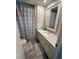 Bathroom featuring a shower and bathtub combination, a single sink vanity, and tile floors at 508 51St W Ave, Bradenton, FL 34207