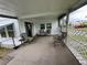 Enclosed patio with comfortable seating, creating a cozy and inviting outdoor space for relaxation at 508 51St W Ave, Bradenton, FL 34207
