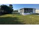 This home has a fenced side yard, screened in porch, and mature landscaping at 508 51St W Ave, Bradenton, FL 34207
