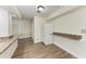 Kitchen with granite counter, white refrigerator, and wood-look floors at 5616 33Rd E St, Bradenton, FL 34203