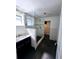 Updated bathroom with a glass-enclosed shower, dark tile flooring, and modern vanity with white marble countertops at 611 19Th W Ave, Palmetto, FL 34221