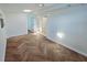 A bright bedroom featuring herringbone flooring, a skylight, and double French doors leading to an outdoor space at 611 19Th W Ave, Palmetto, FL 34221