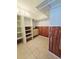 A closet with built-in shelving and cedar-planked walls at 611 19Th W Ave, Palmetto, FL 34221