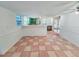 Bright dining room area adjacent to the kitchen features tiled floors and white walls, and a ceiling fan at 611 19Th W Ave, Palmetto, FL 34221